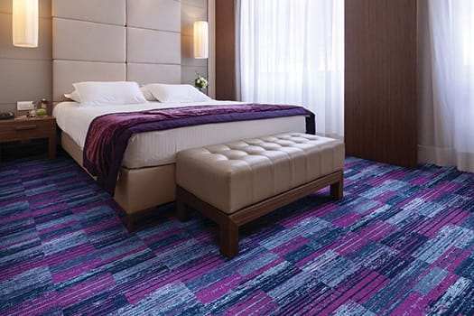 Purple pattern carpet in bedroom